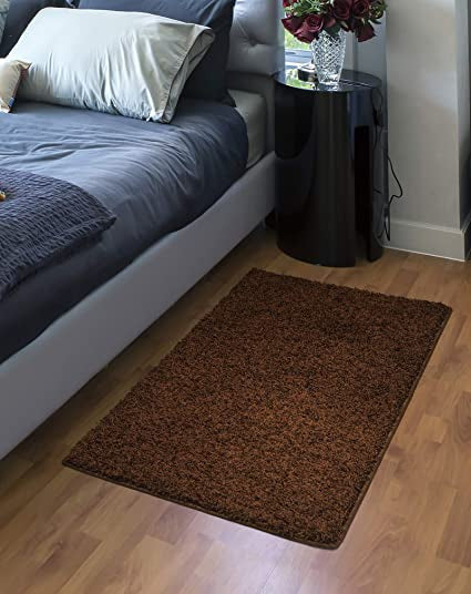 Fiji Chocolate Rug on the side of bedroom